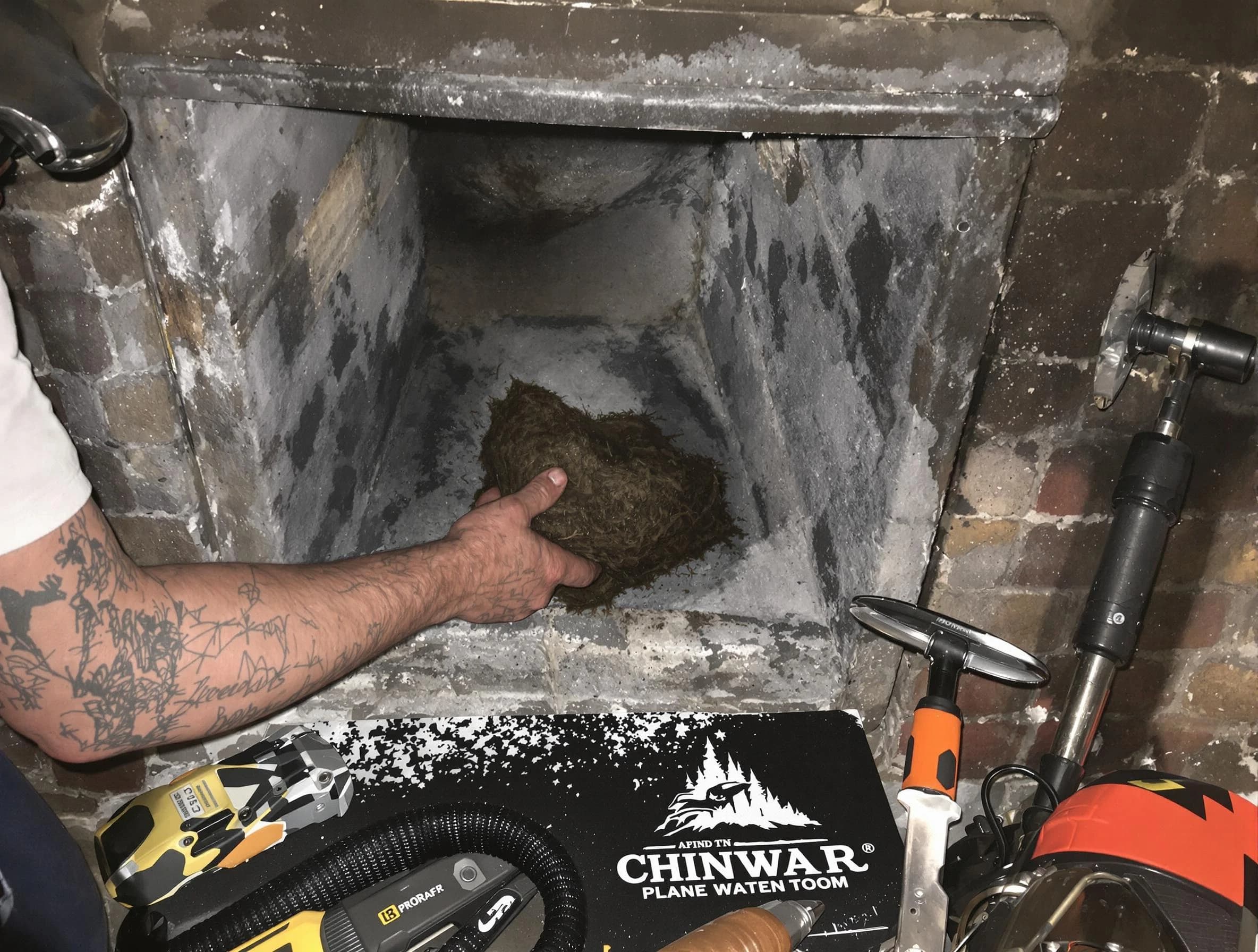 Spring Hill Chimney Sweep safely removing debris and screening chimney in Spring Hill, TN